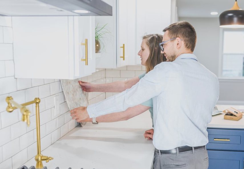 Tile Backsplash Installation, a couple examines backsplash tiles for their modern kitchen renovation